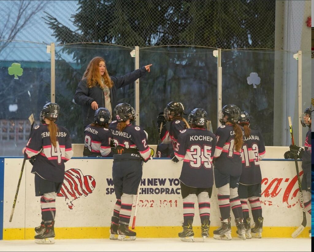 Emma behind the bench